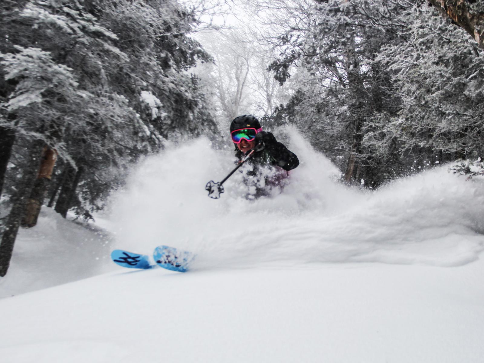 PowSki_FemaleSkier_Trees