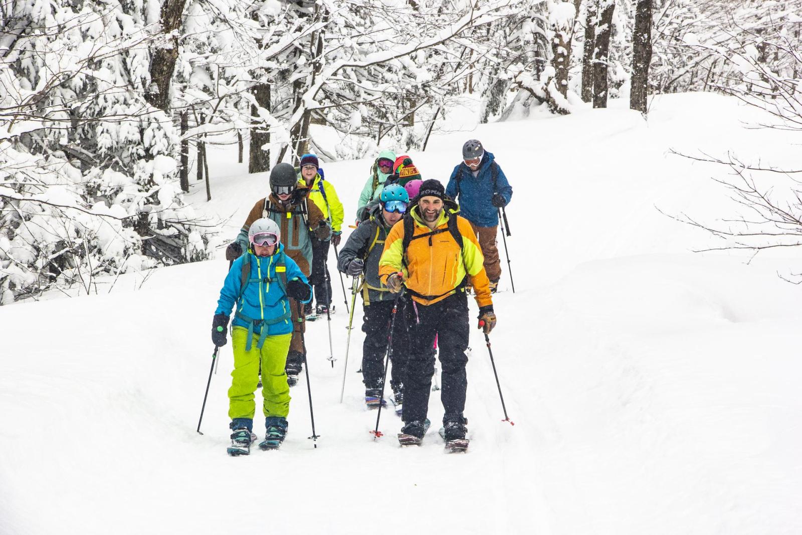 group of splitboarders smiling