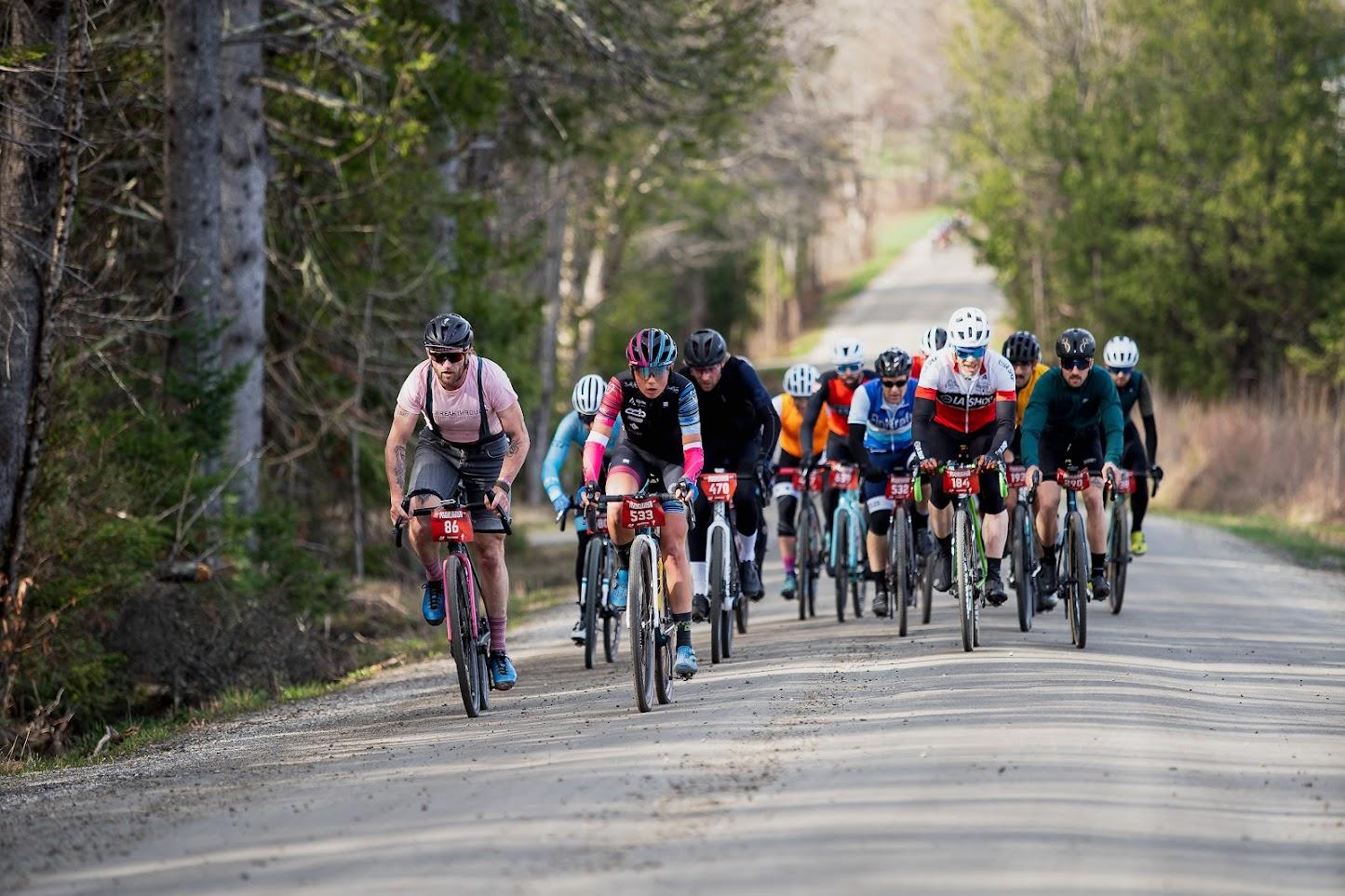 racers on bikes on gravel road