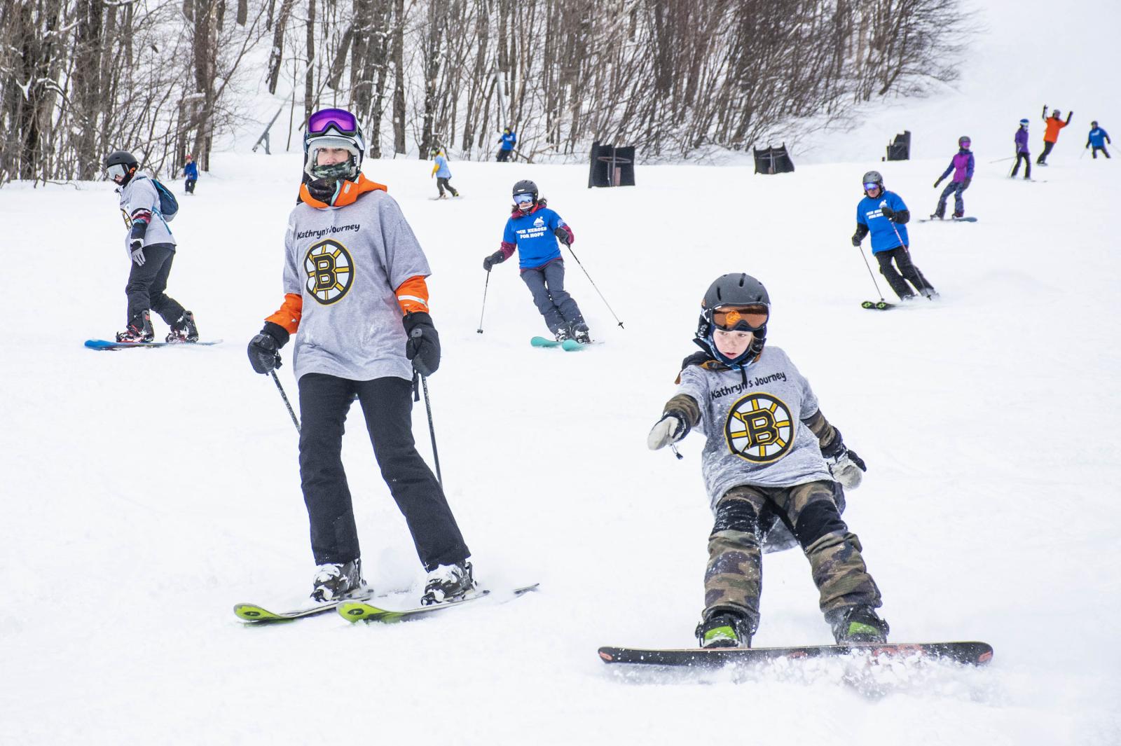 team members skiing and snowboarding 