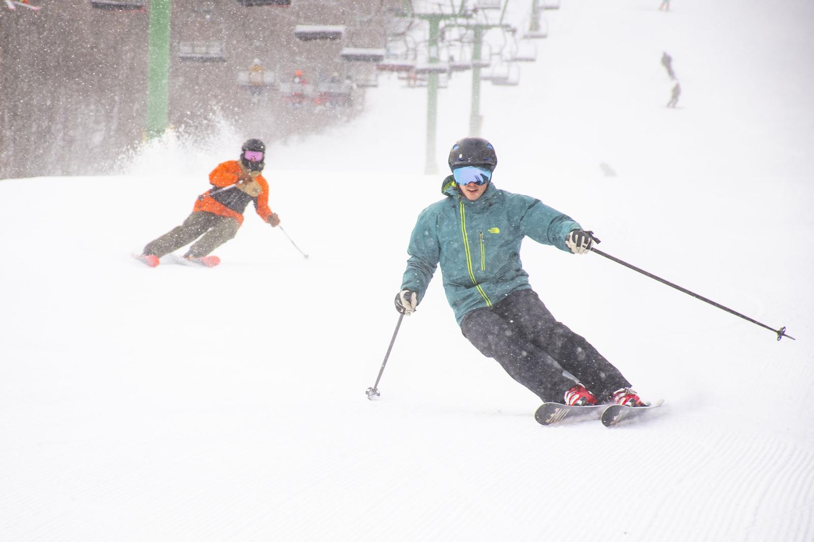 23+24 Season Opening Day skiers carving on snowy Jet trail
