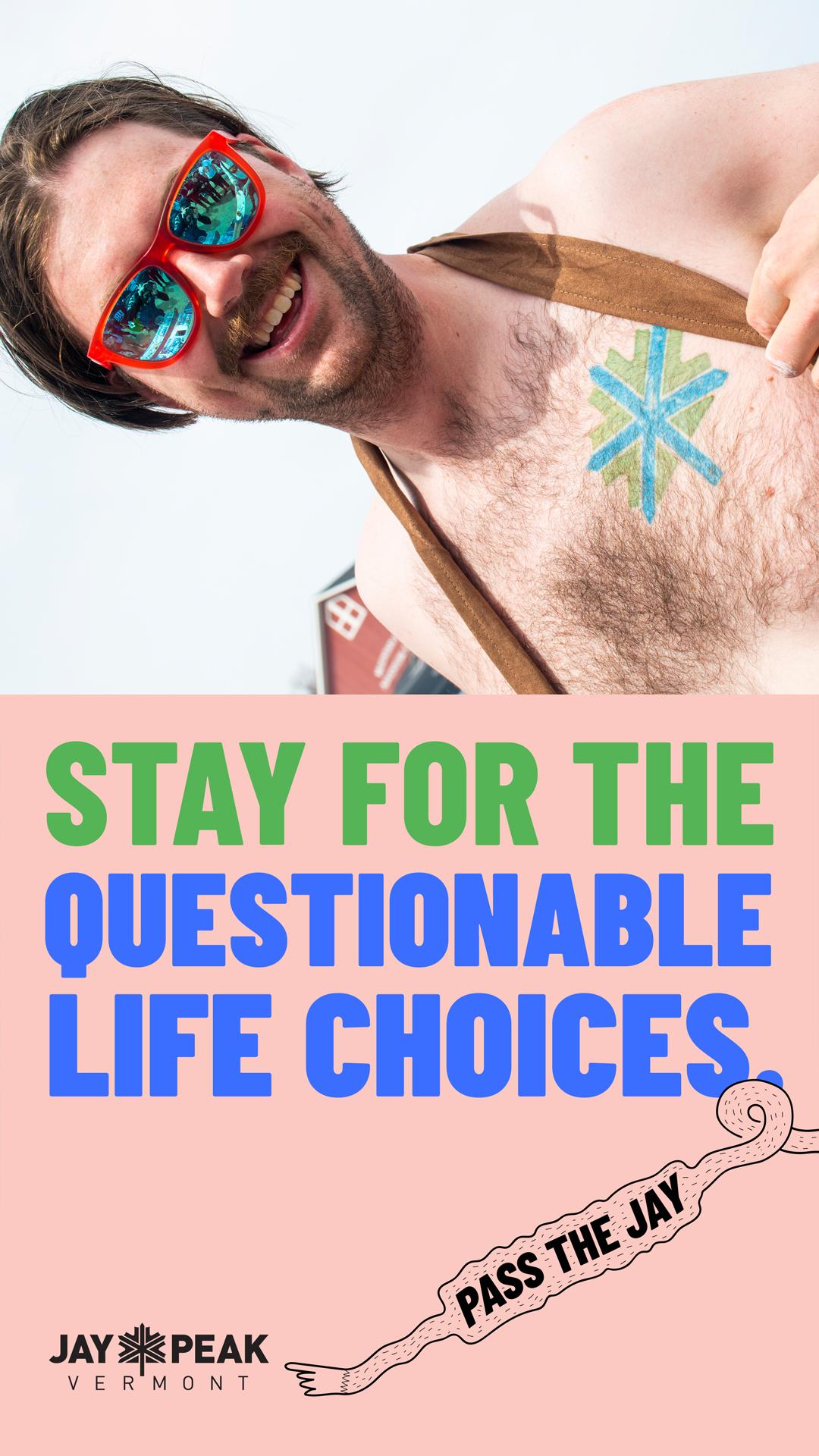Shirtless man with sunglasses smiling, holding a drink.