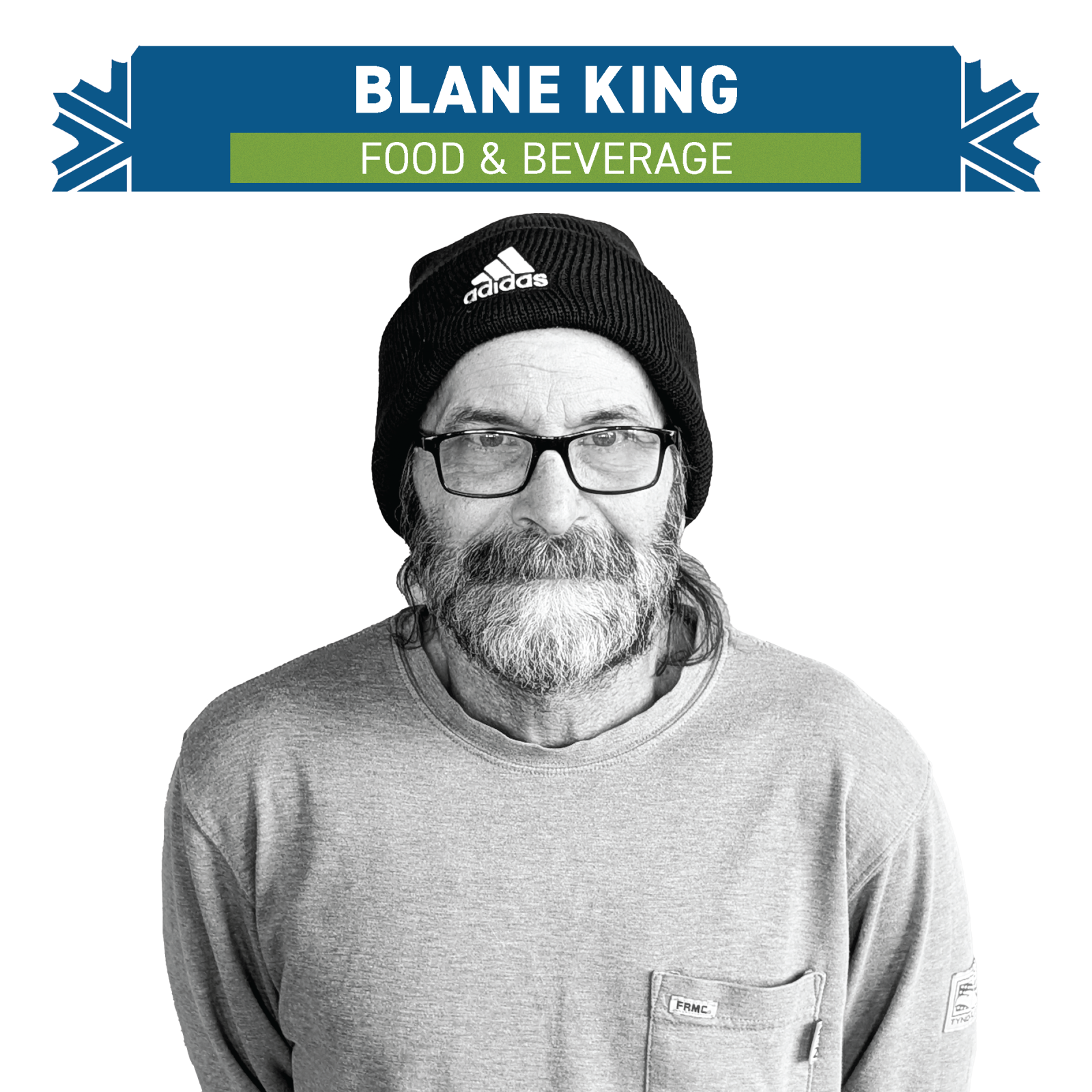 Man with beard and glasses wearing a black beanie and a gray sweatshirt.