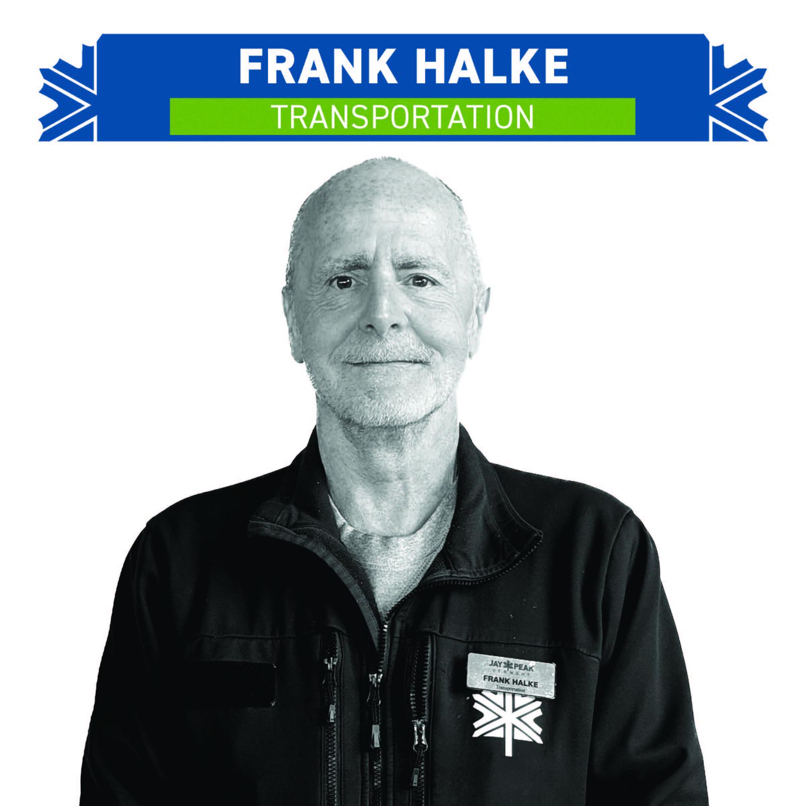 Black and white portrait of a man in a jacket with badges.