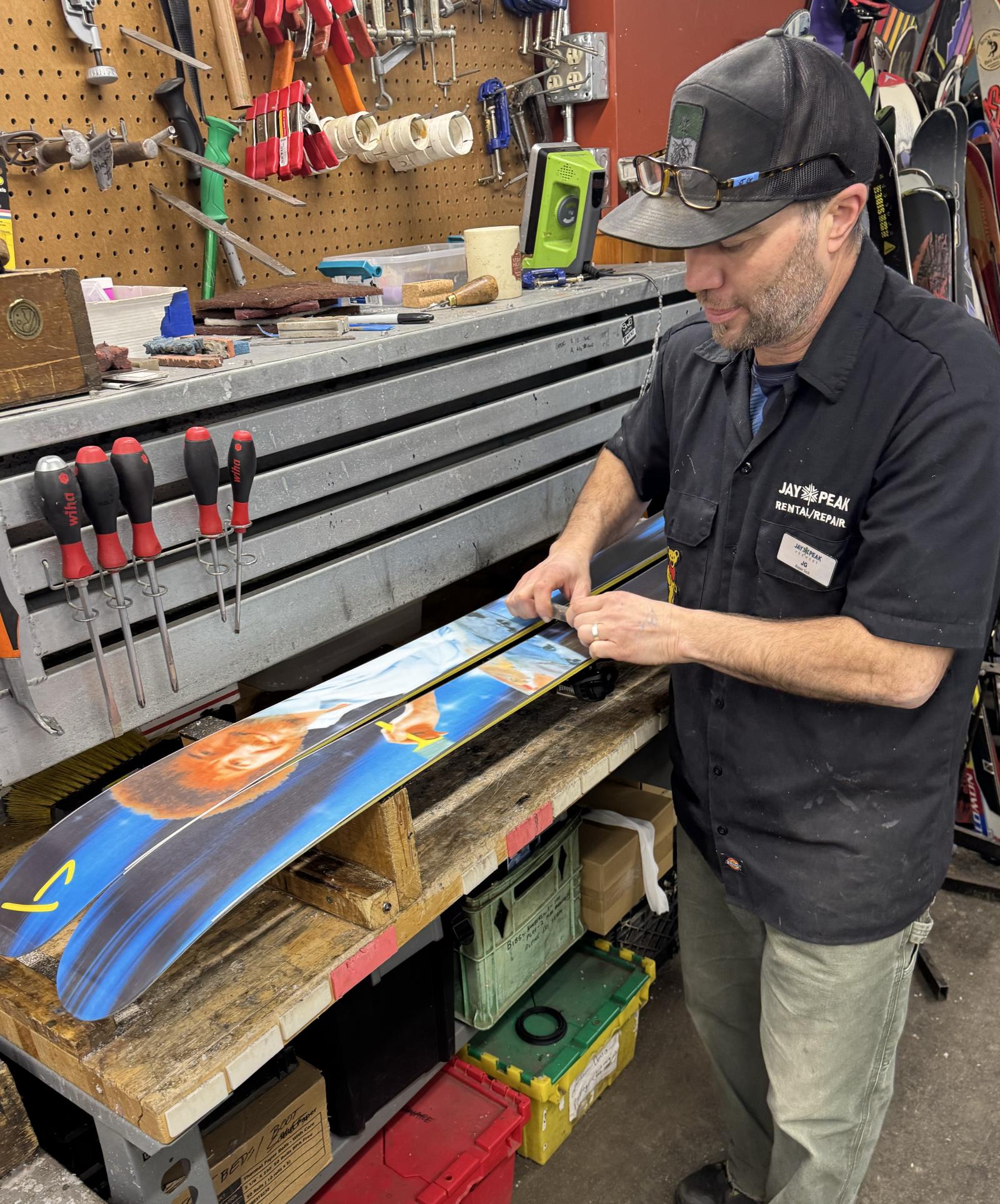 JG tuning his Bob Ross skis in the rental shop.