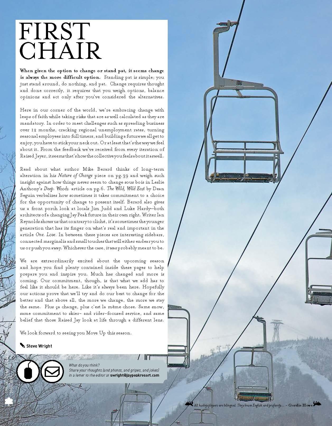 Ski lift chairs suspended in the air against a blue sky.