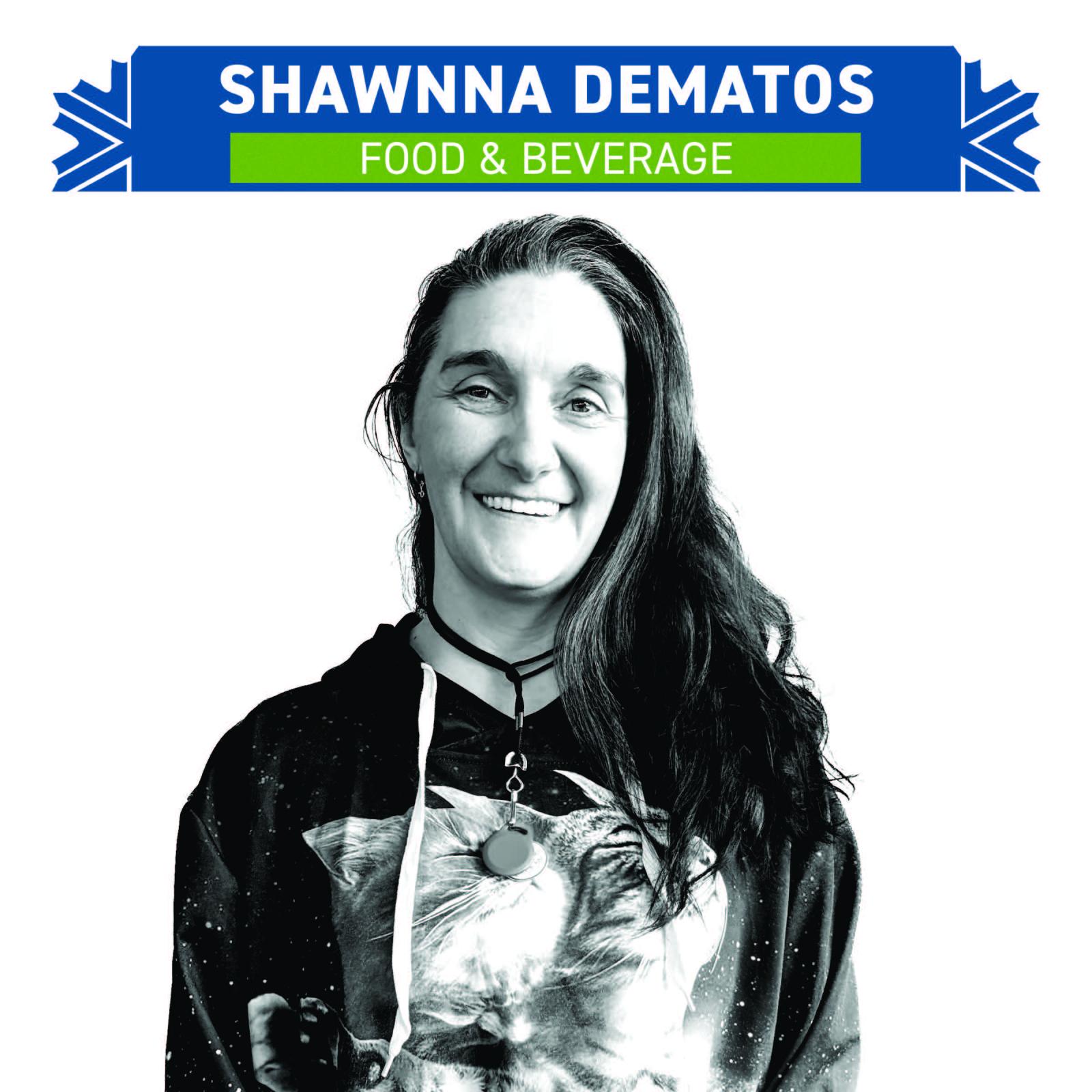 Smiling person in a black hoodie with a cat design, white background.