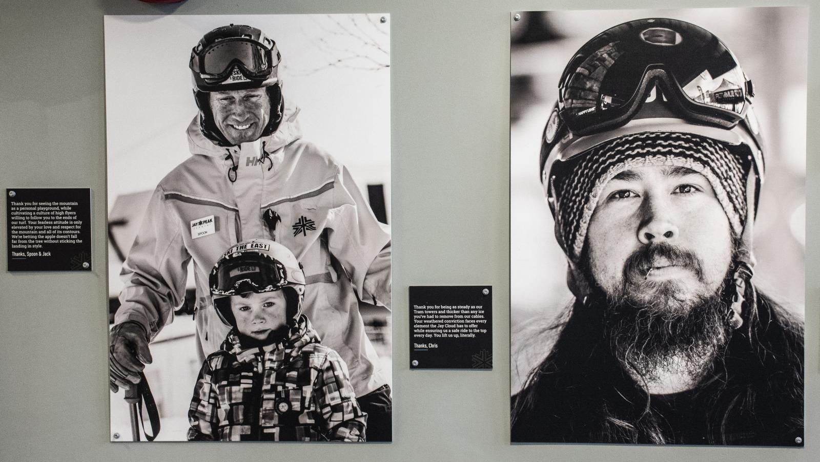 Black and white photos of skiers in winter gear on a wall.