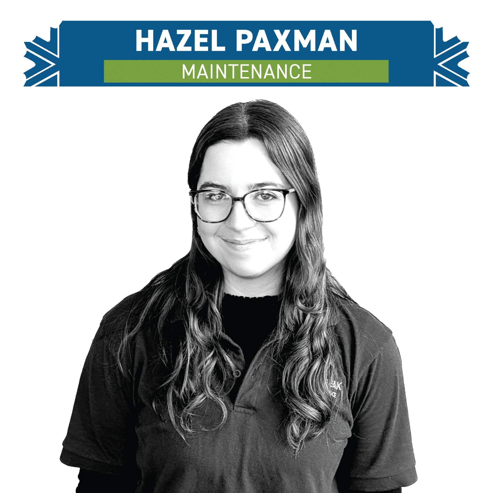 Black and white photo of a person with glasses, smiling, in maintenance role.