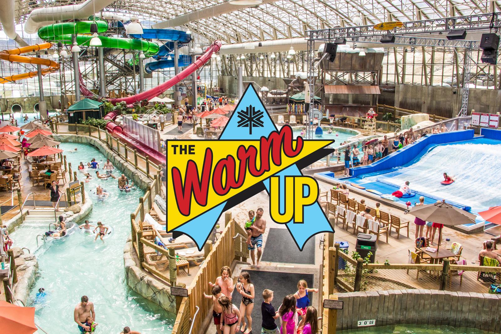 Indoor water park with slides and wave pool, colorful and lively atmosphere.
