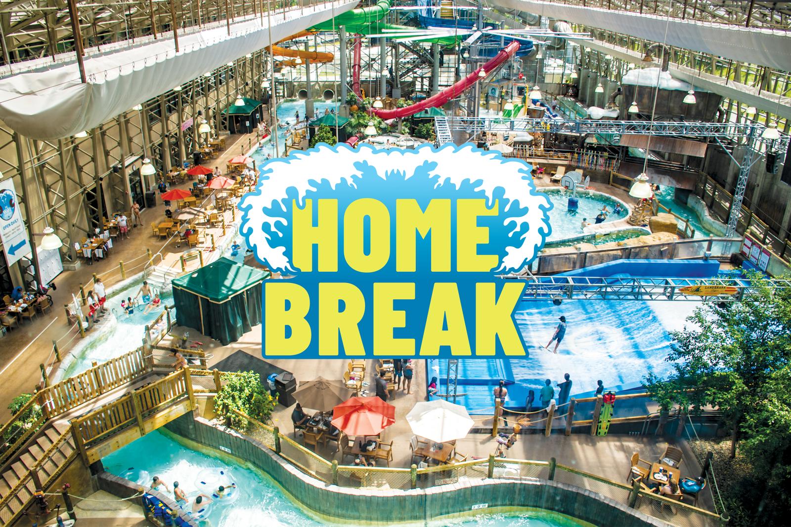 Indoor water park with slides, pools, and lounging area.